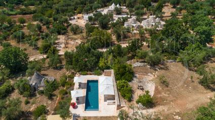 The luxury villa with swimming pool immersed in the Valle d`Itria, taking with a drone view