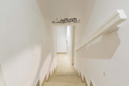The stairs that take to the double bedroom